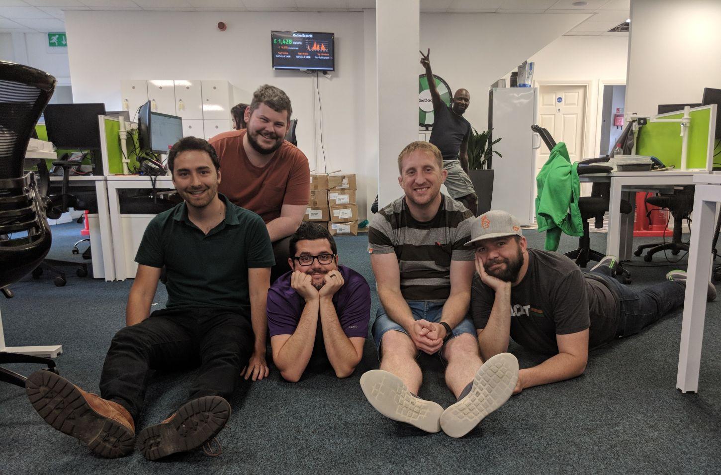 a group of men posing for a photo