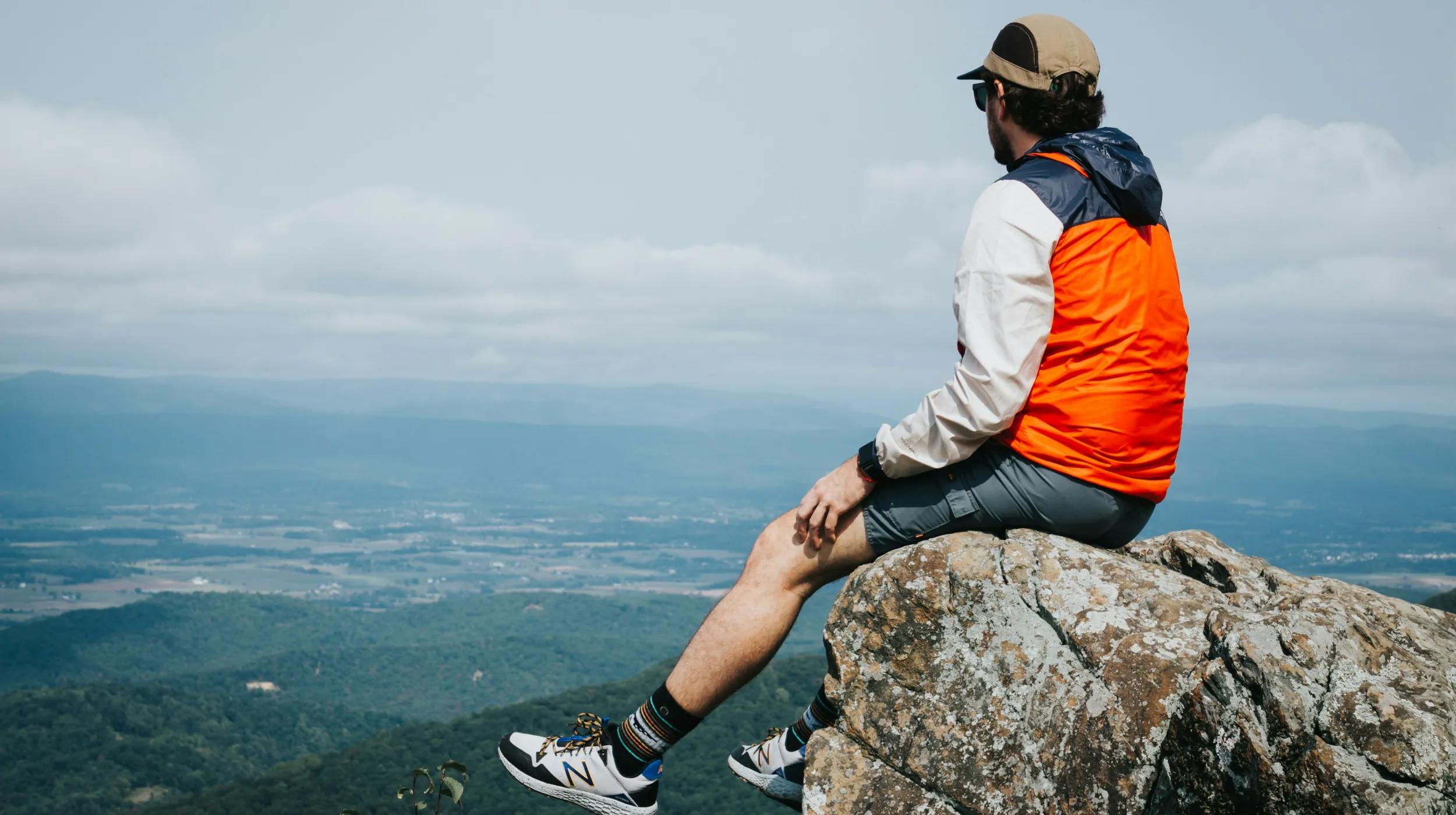a man sitting on a rock