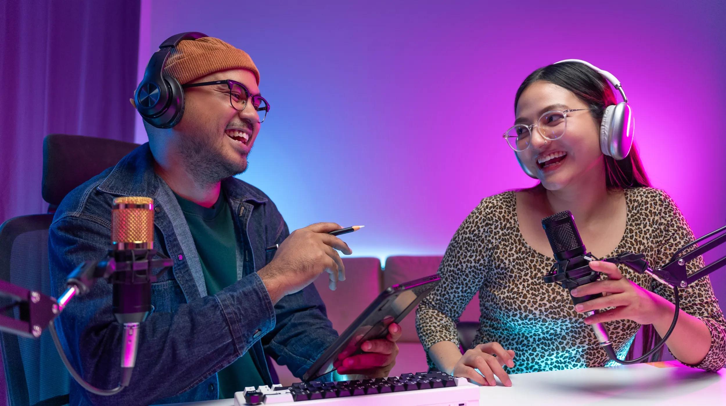 a man and woman wearing headphones