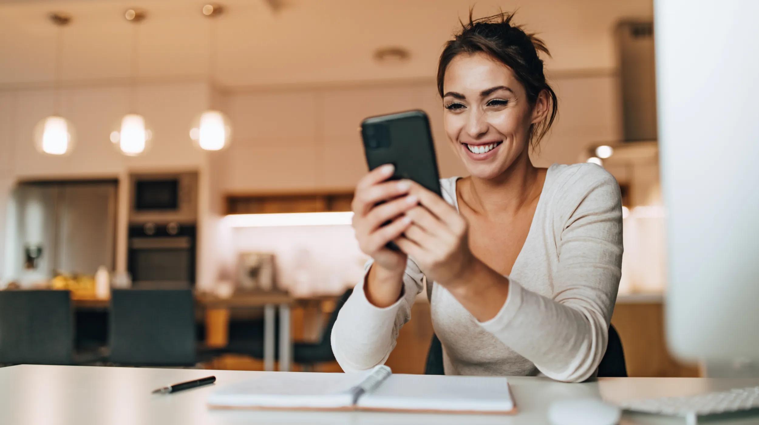 a woman holding a phone