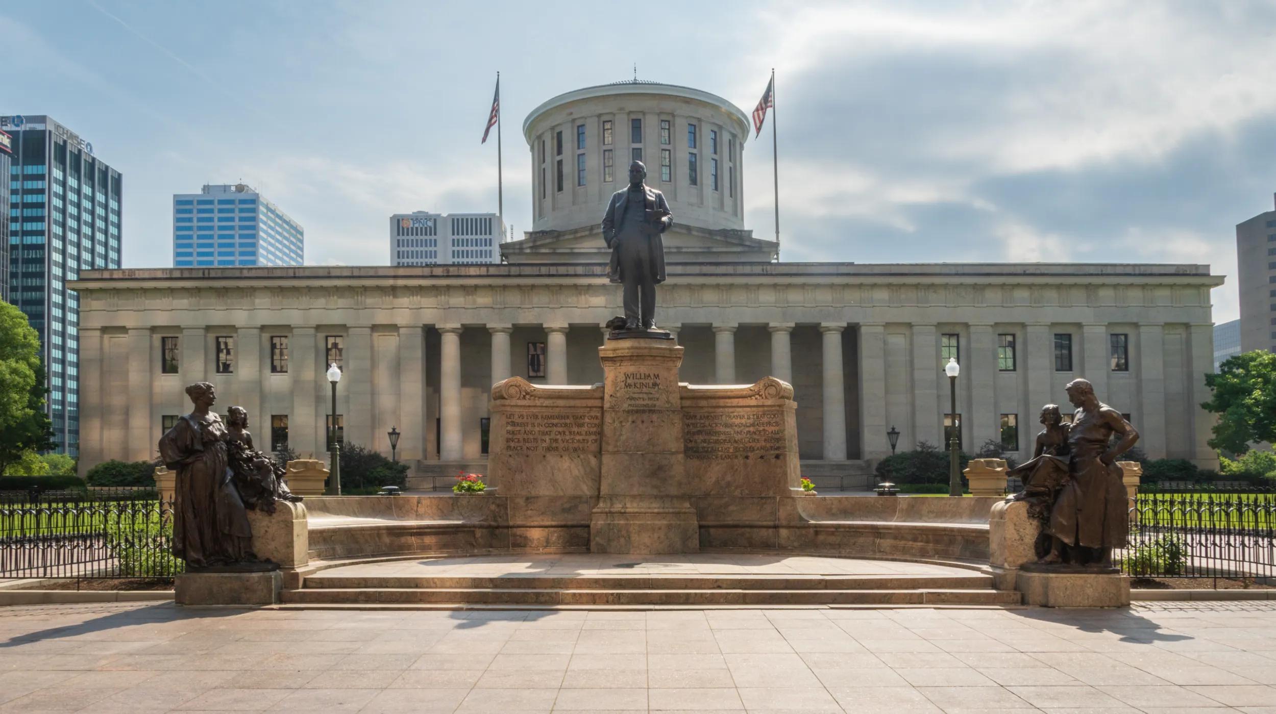 a statue in front of a building