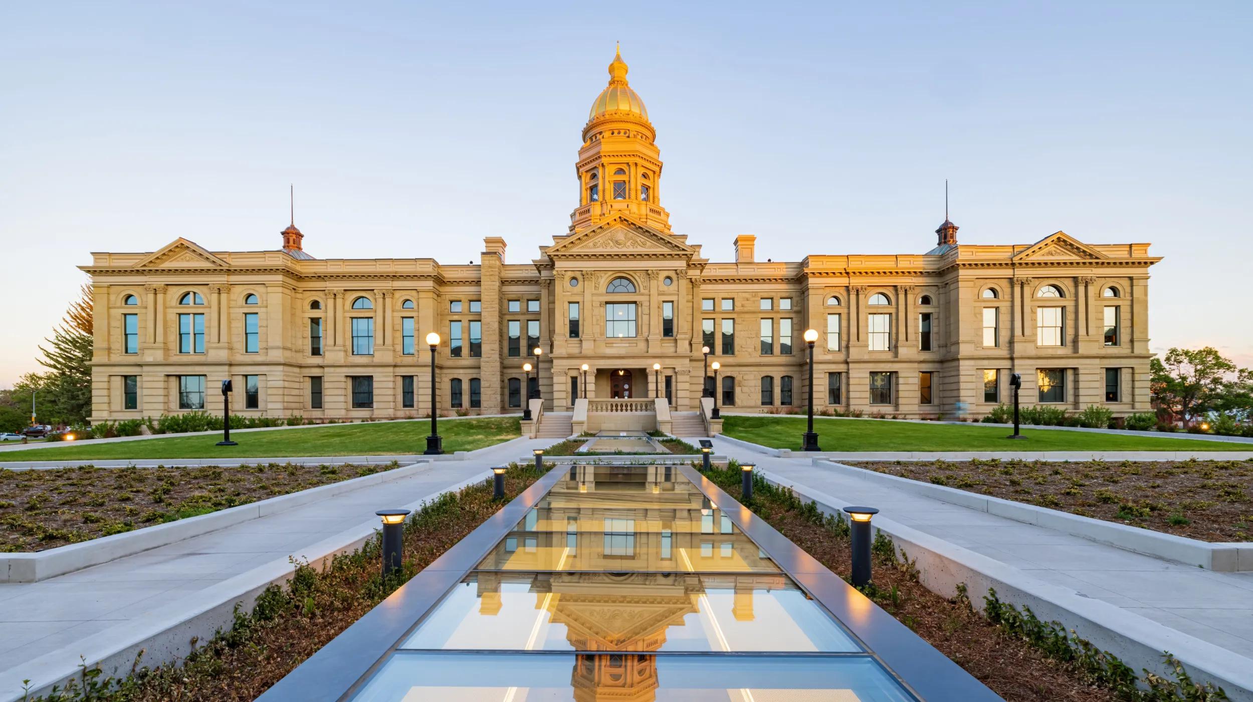 a large building with a fountain in front of it