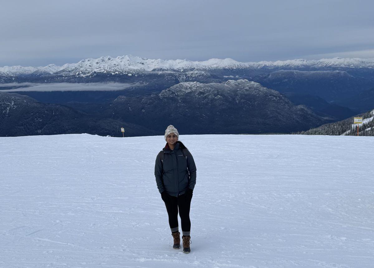 a man standing in a snowy field