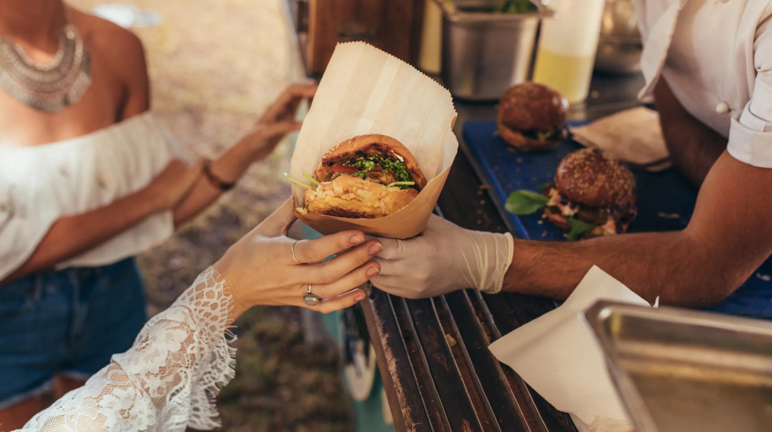 customers taking orders from a food truck
