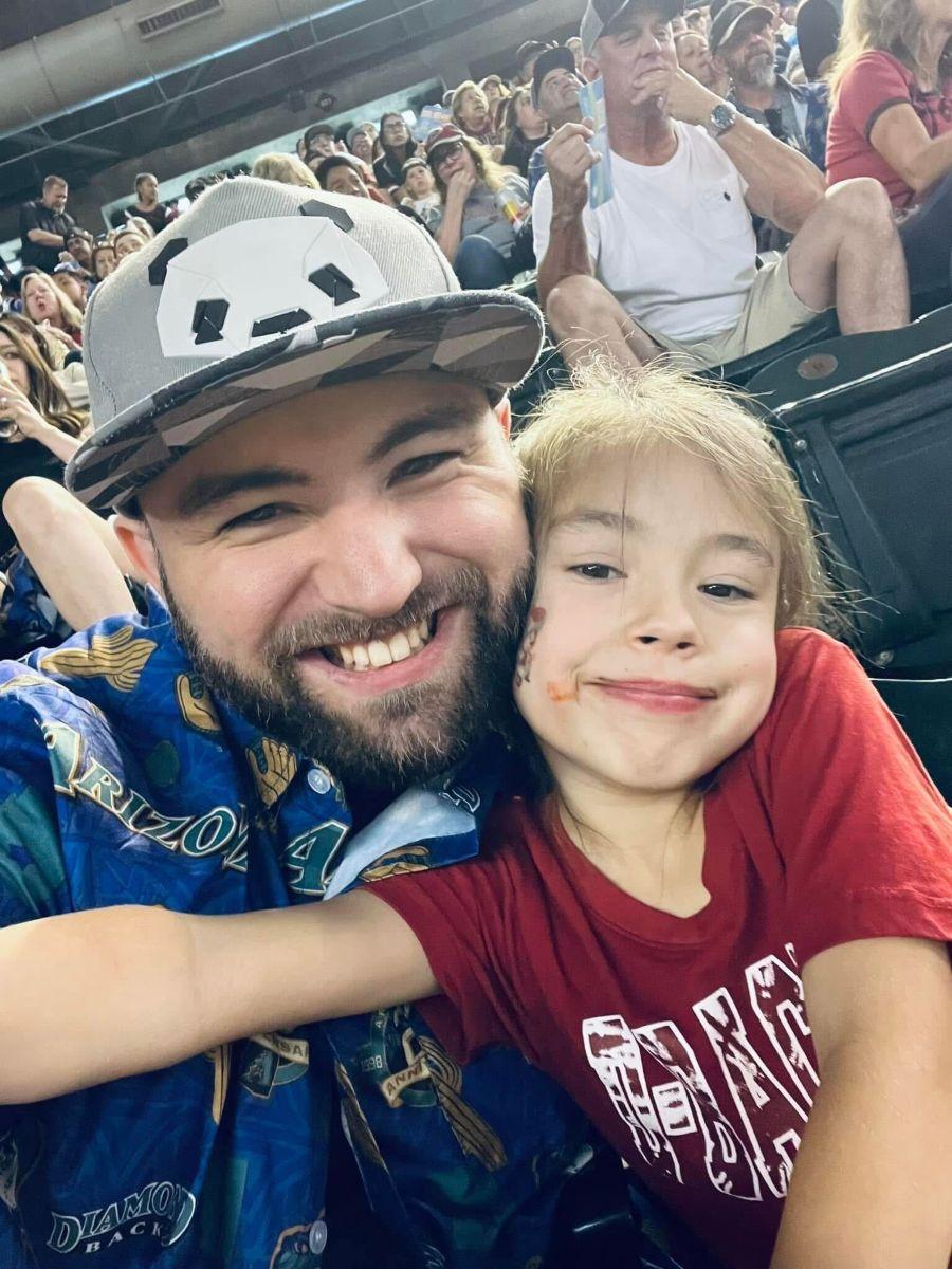 a person and a child posing for the camera