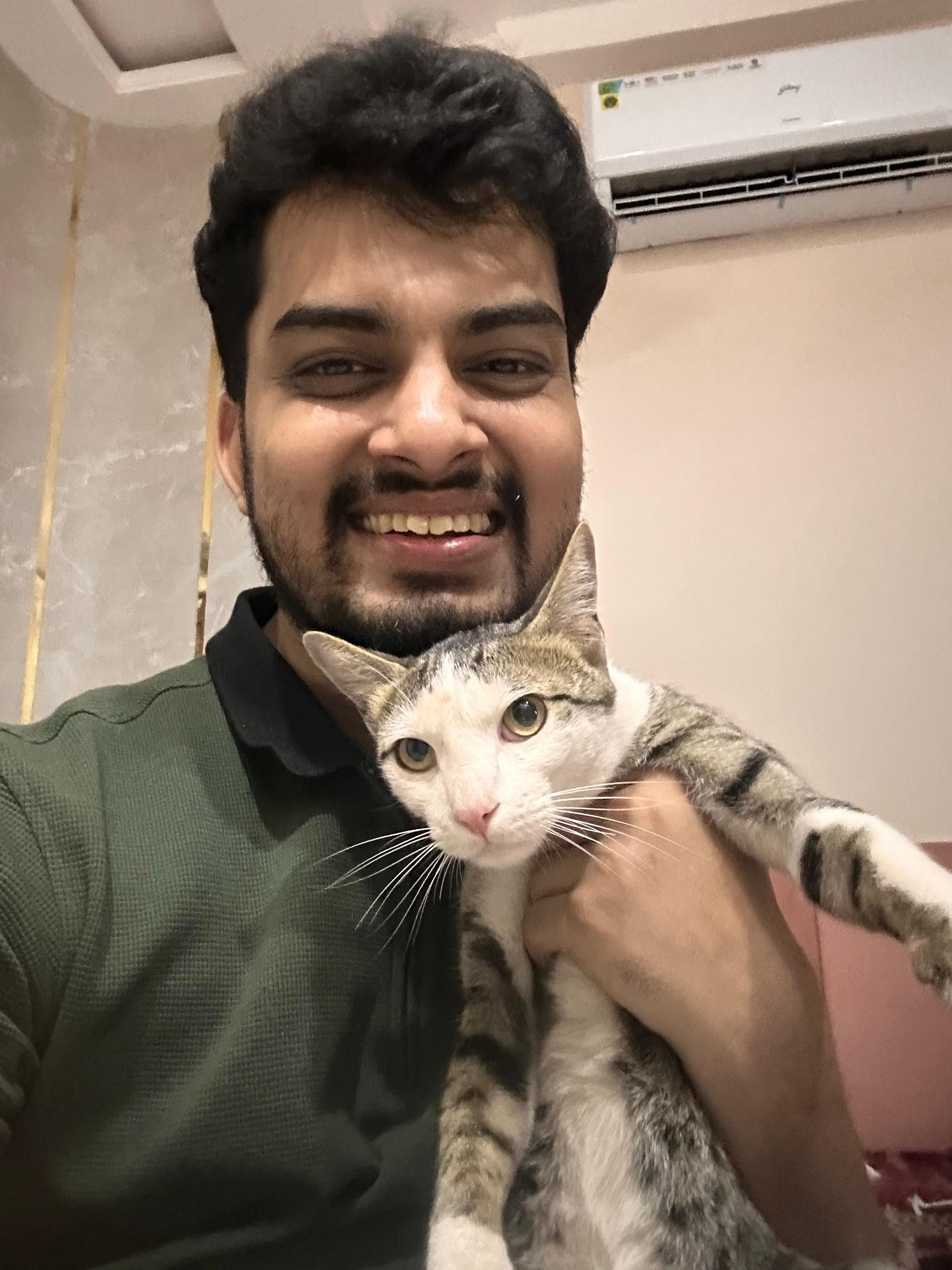 a man holding a cat