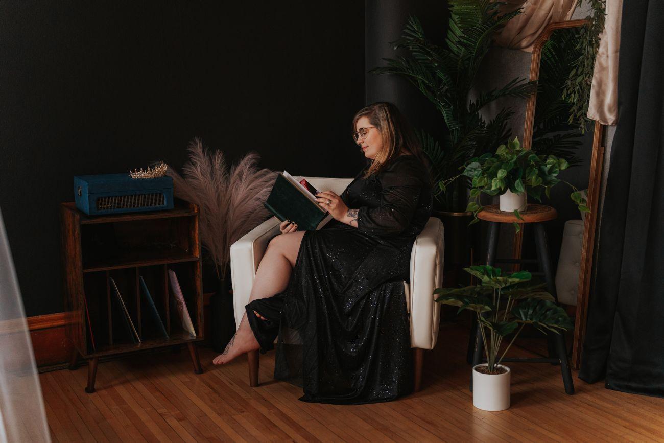 a person sitting on a chair with a laptop