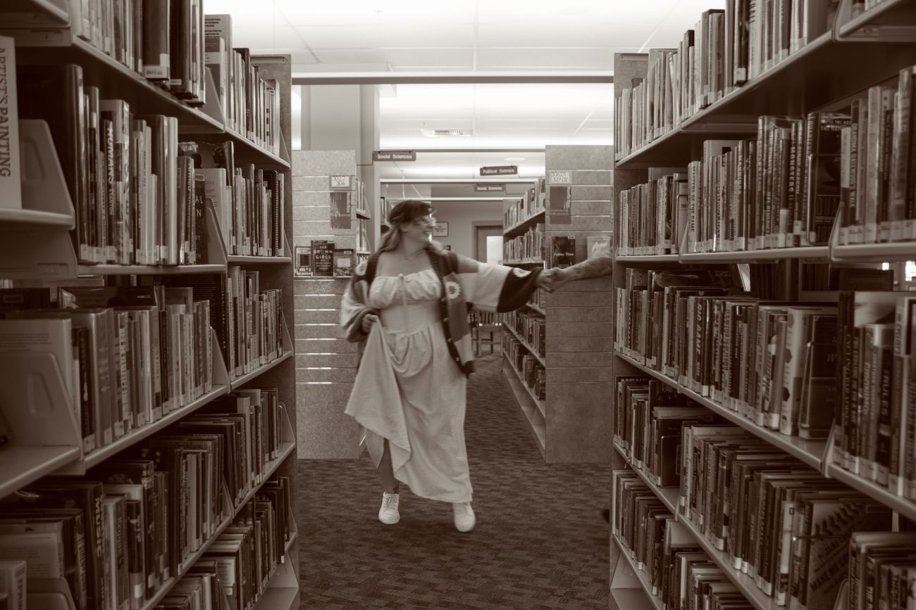 a person standing in a library