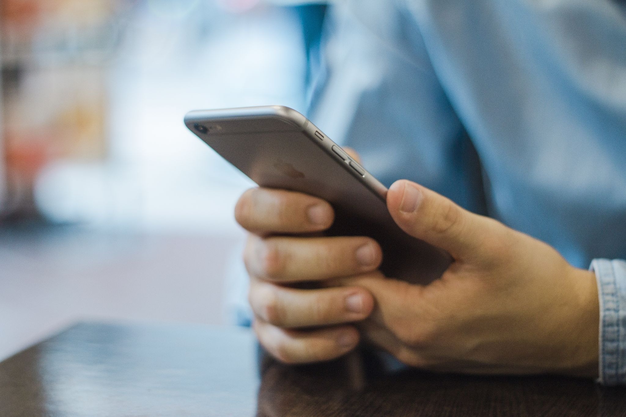 A PAir of Hands Operate a Smartphone