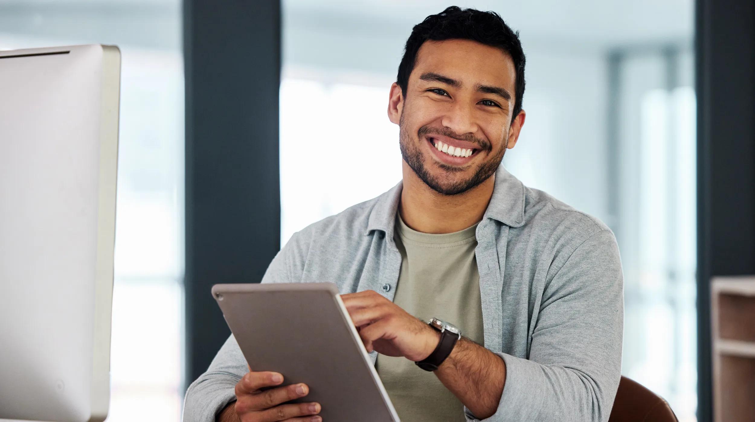 a man holding a laptop