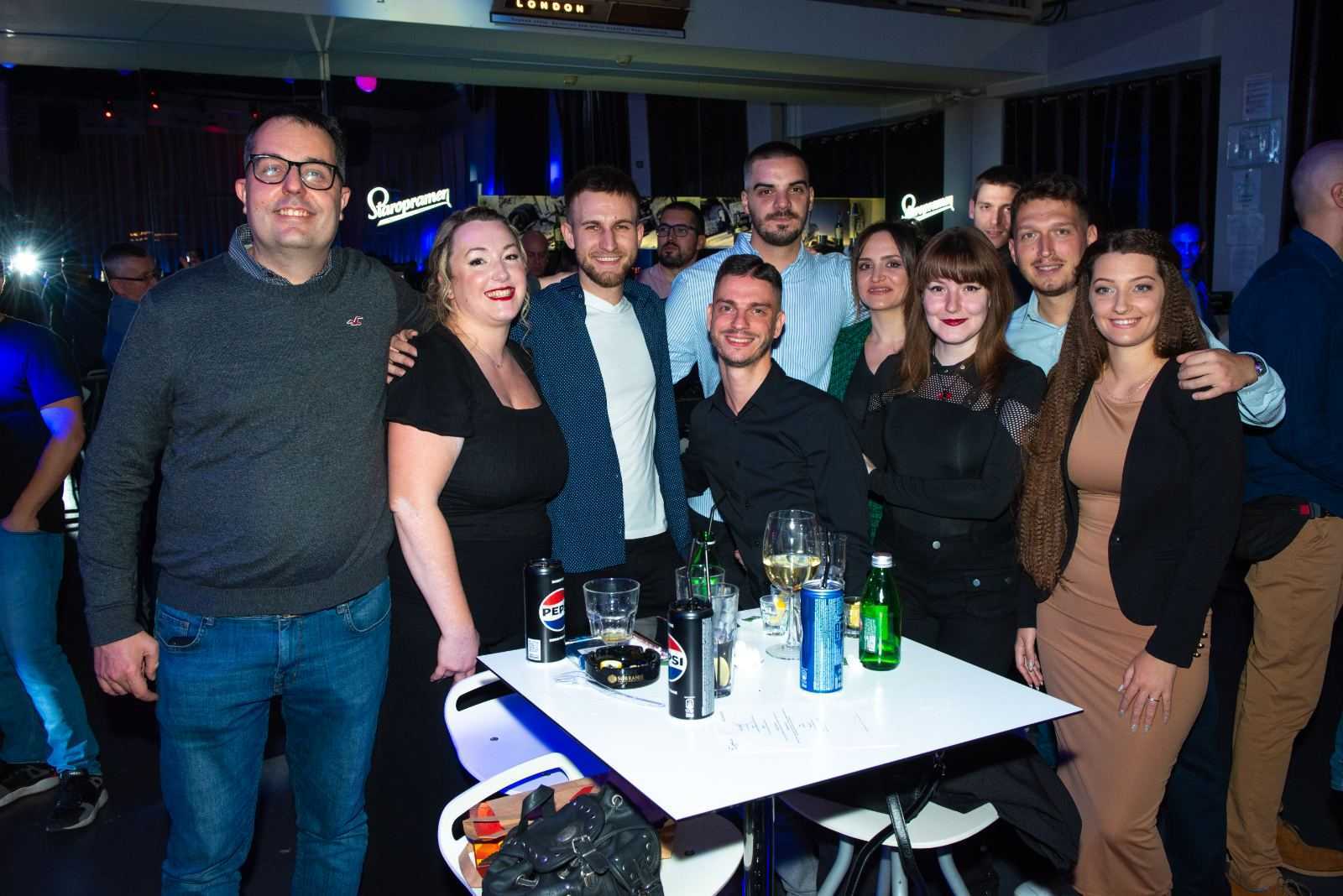 a group of people posing for a photo