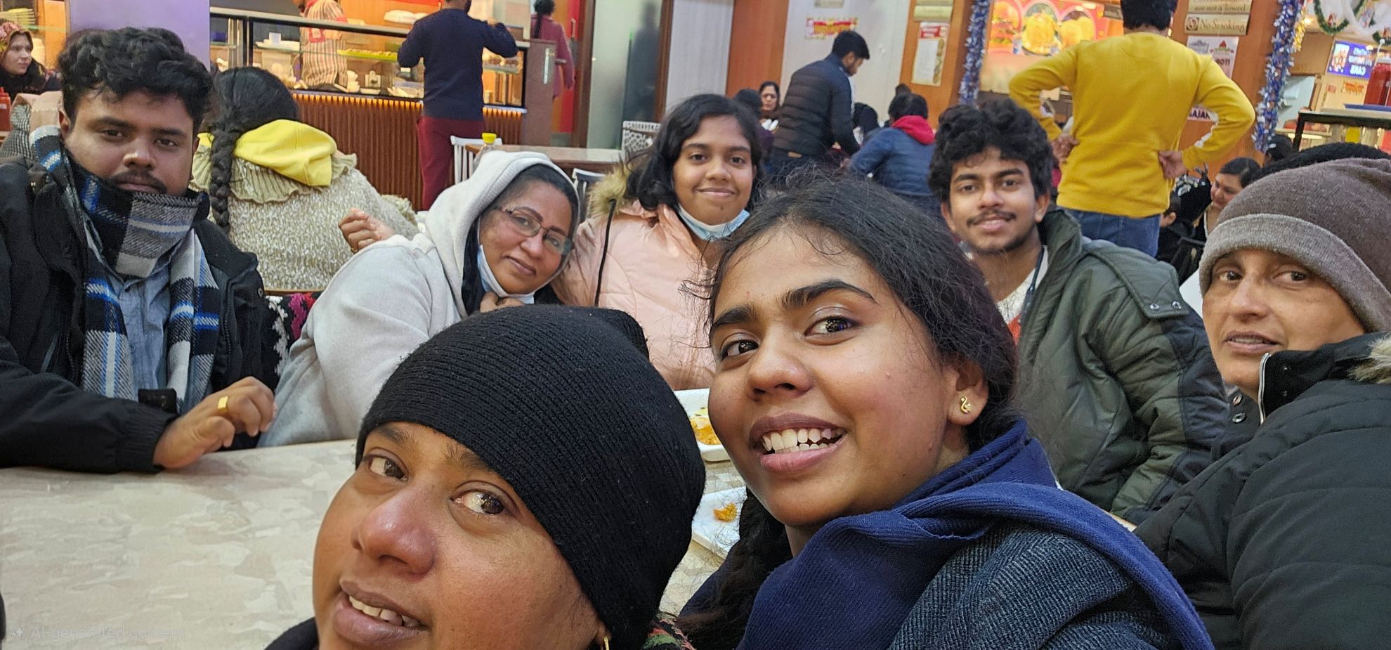 a group of people sitting together smiling