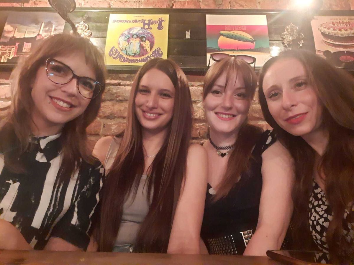 a group of women posing for a photo