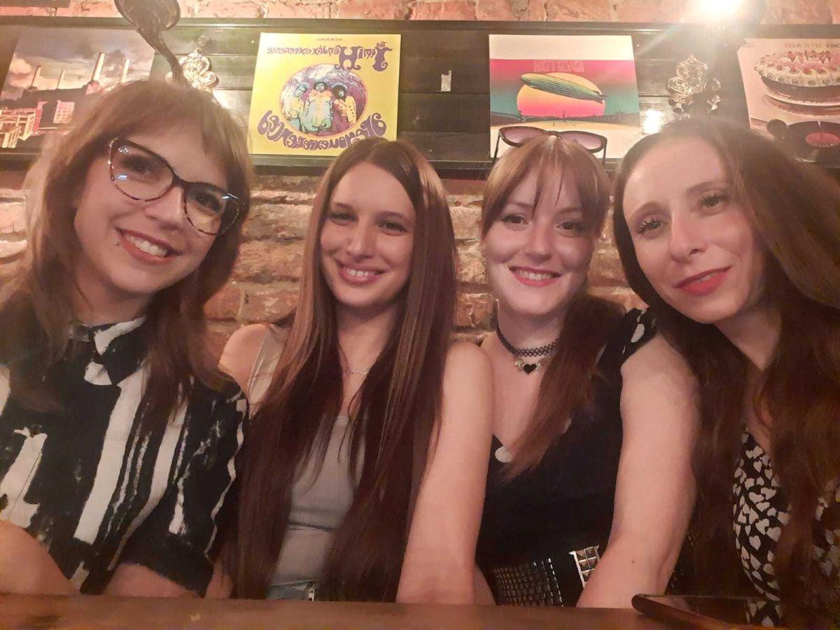 a group of women posing for a photo