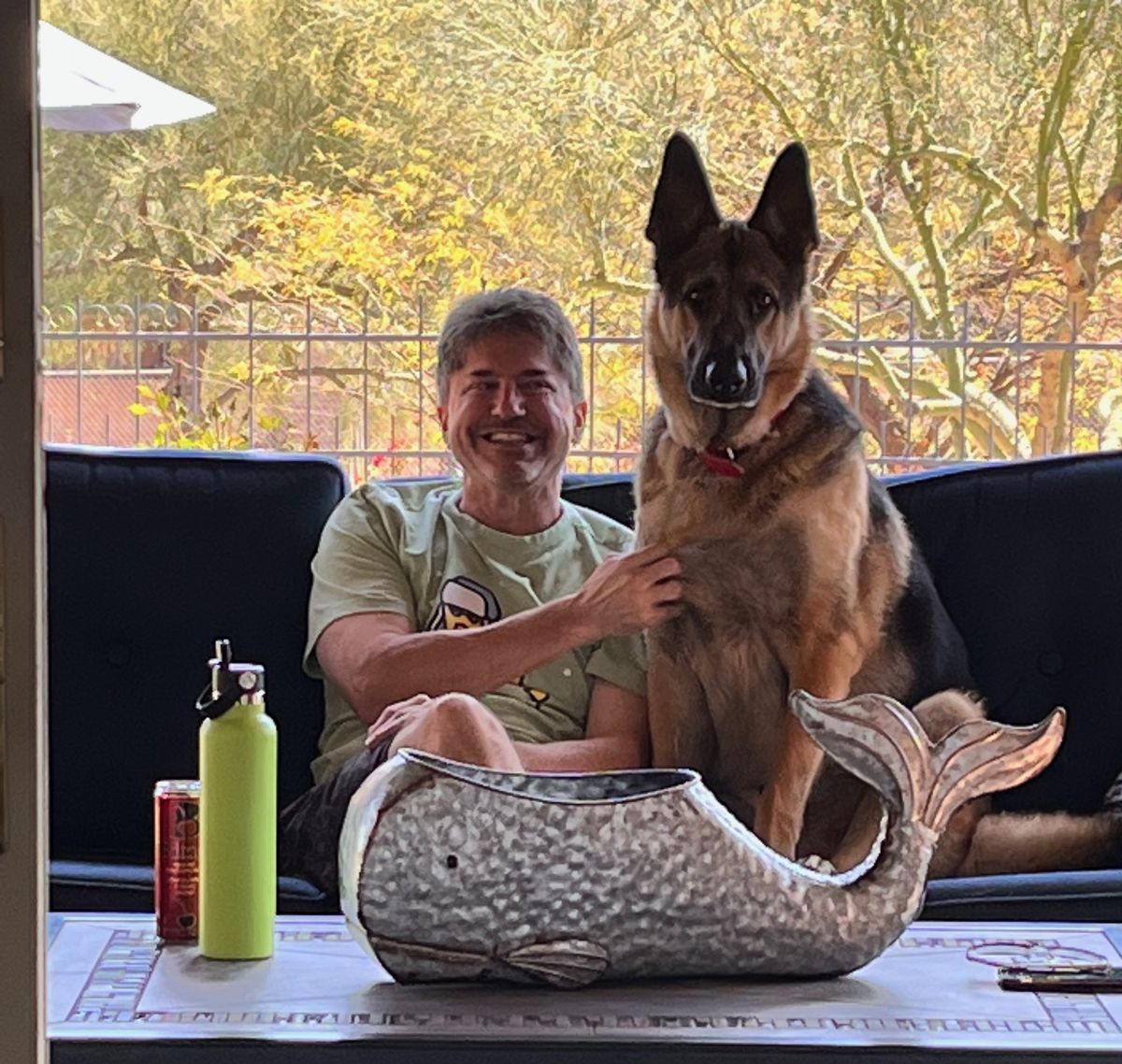 a dog sitting on a man's lap
