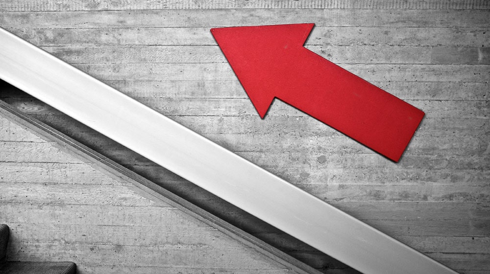 Arrow Pointing Up Stairs Illustrates Increasing Freemium Conversion Rate
