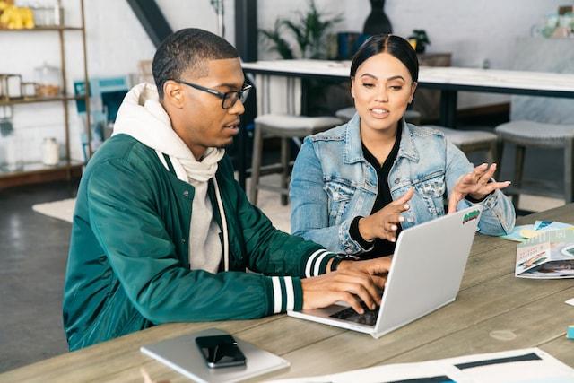 Ayesha Curry with Website Designer at Laptop