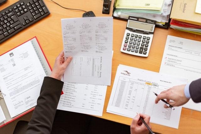 Bookkeeper VS Accountant Coworkers Managing Books