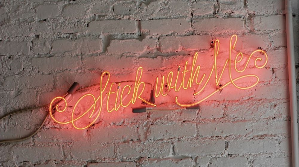 Neon Sign On Grey Brick Wall