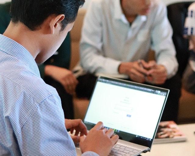 Client Onboarding Man Working On Laptop