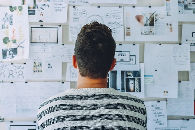 Man Reviewing Details For Market Analysis