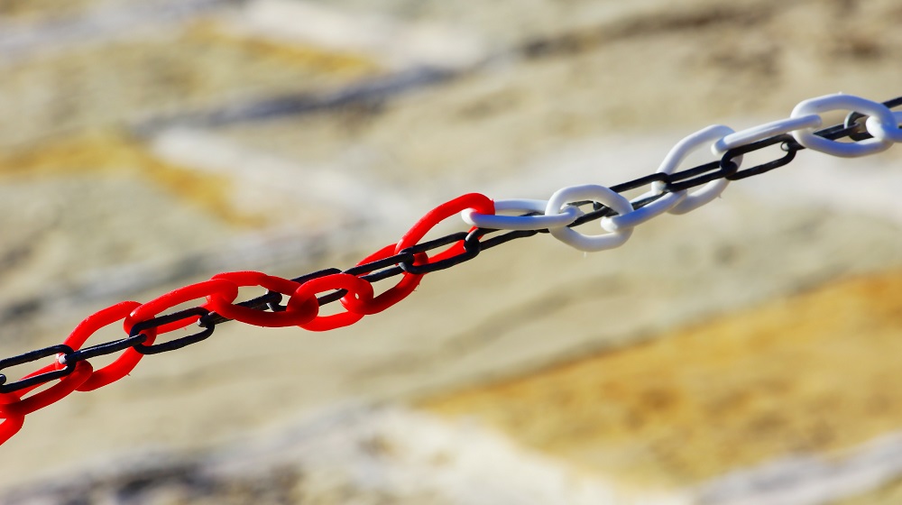 Red And White Chain Running Along Third Chain
