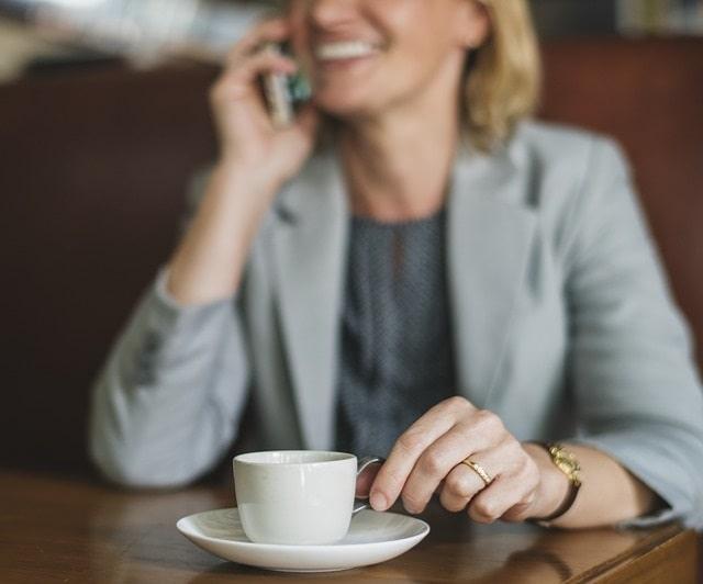 Follow Up With Clients Happy Woman On Phone Drinking Coffee