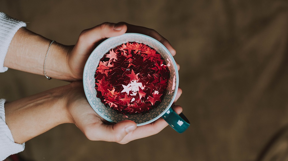 Person Holding Mug Filled With Stars