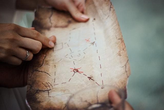 Hands Pointing On A Map