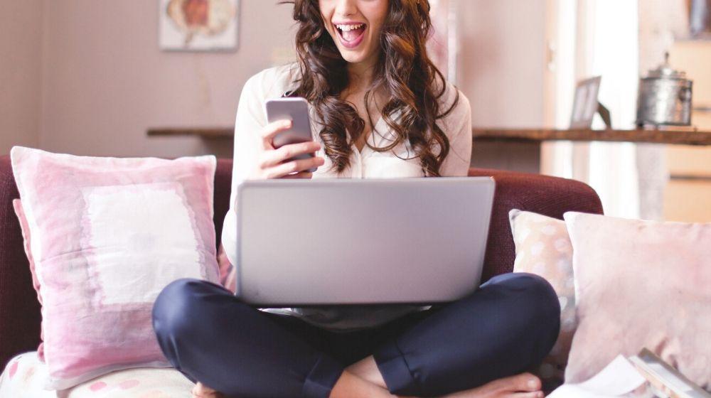 Happy Woman With Smartphone Computer Represents Creating Effective Website Home Page