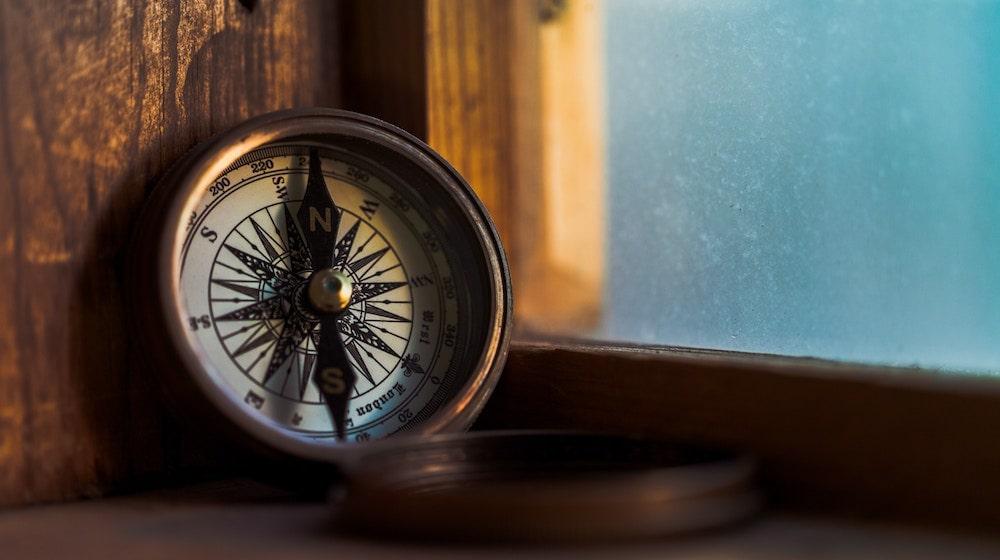 How To Become A Mentor Compass Resting on Windowsill