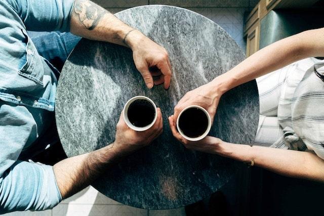 How To Become A Mentor Two People Chatting Over a Cup of Coffee