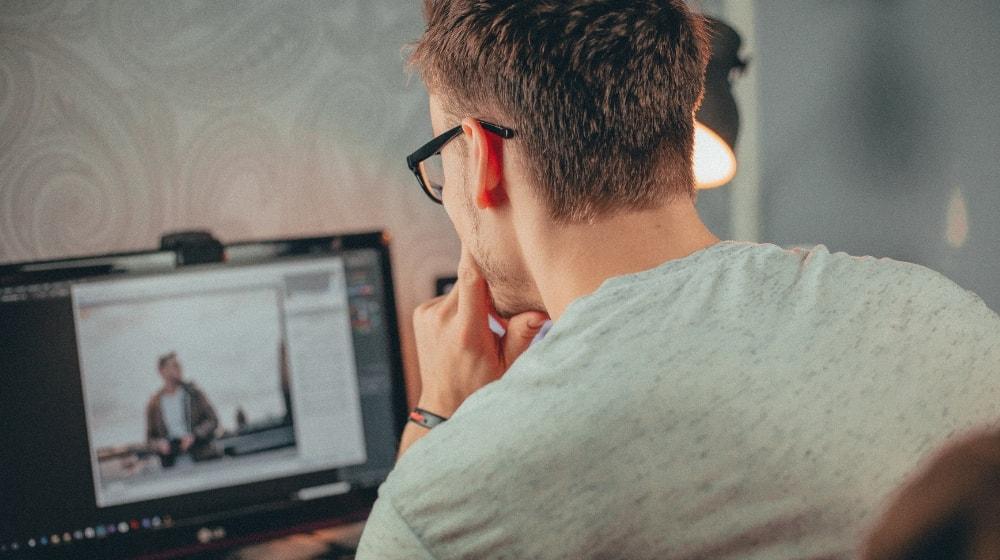 How To Design A Website Man At Desktop Computer