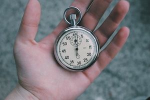 How To Increase Blog Traffic Man Holding Stopwatch