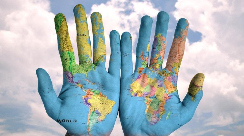 International Expansion Map Of The World On Hands