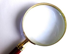 Magnifying Glass Represents Email Subject Line Checker Tools