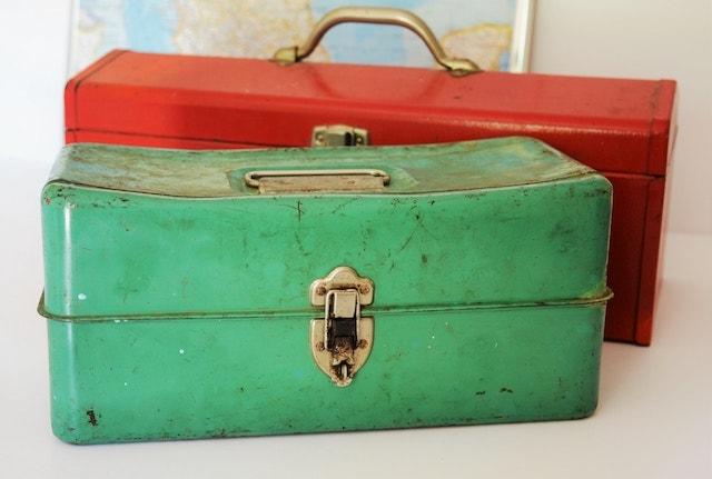 Green and red vintage tool boxes