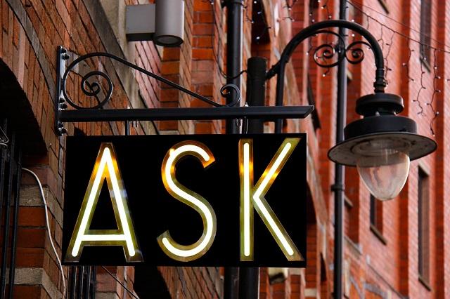 Street Sign And Lamp With The Word Ask In Lights