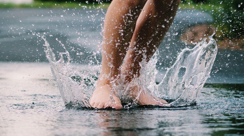 Feet Splashing In Water