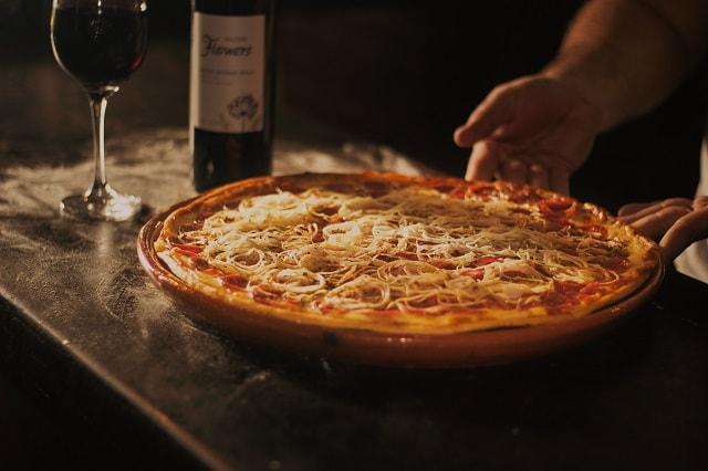 Pizza Delivery And Bottle Of Wine