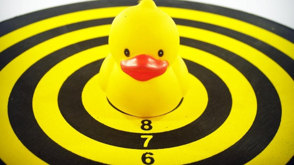 Product Targeting Rubber Duckie On Dartboard