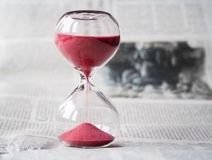 Red Hourglass Illustrates Time Commitment for Domaining