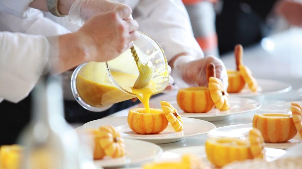 Restaurant Facebook Page Chef Pouring Soup Into Pumpkin