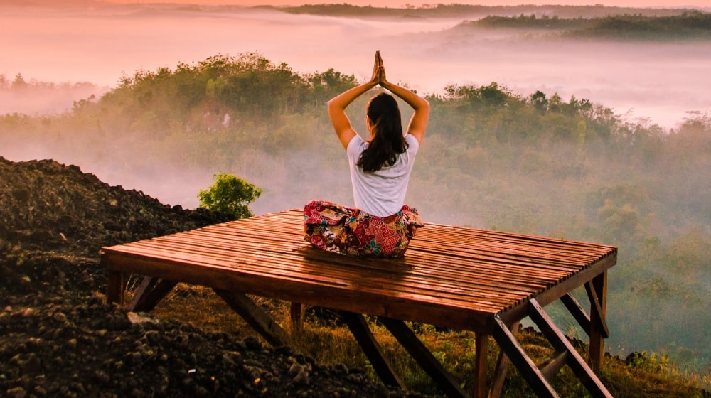 Self Care Tips Woman Meditating On Dock