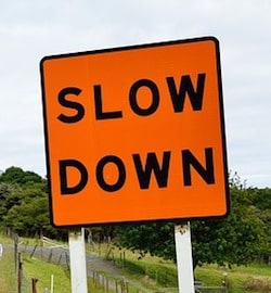Slow Down Sign Represents Taking Time When Investing in Domains