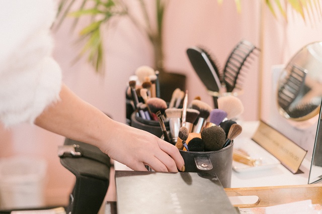 Makeup Brushes And Accessories On A Desk