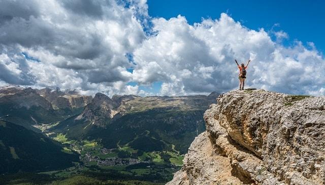 Woman Mountain Climbing Success Overlooking Valley