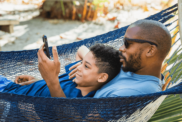 Tyson Toussant in Hammock with Son