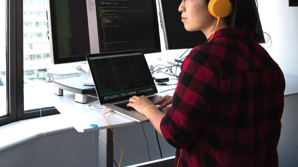 Web Accessibility Issues Girl Coding With Multiple Computers