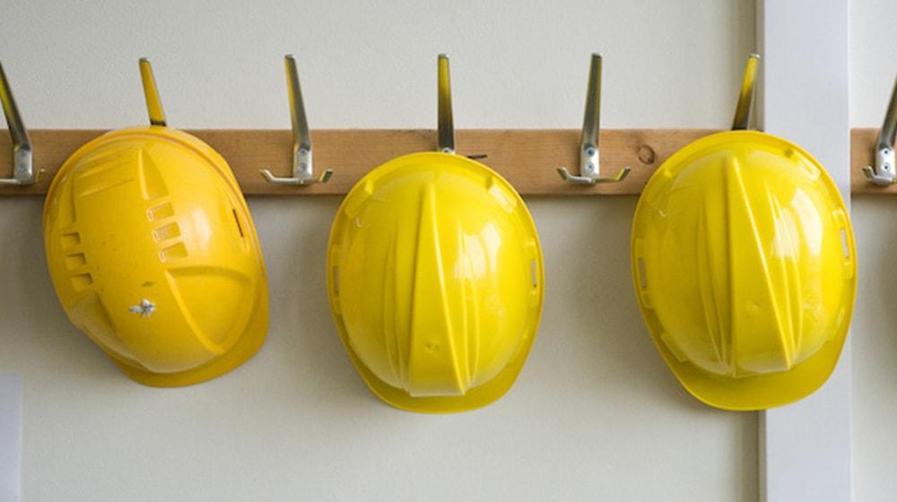 hardhats hanging on wall